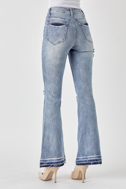 RISEN: MID RISE DISTRESSED SHADOW HEM FLARE
